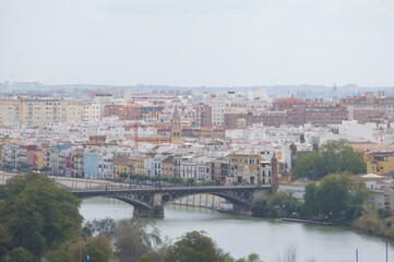 Fototapeta premium Aerial view of Triana an the river Guadalquivir, Seville, Spain
