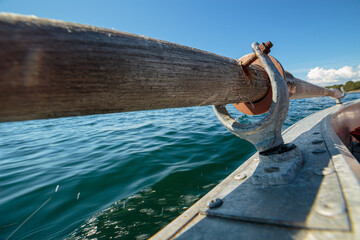 Close up of vintage wooden oars on a aluminum rowboat