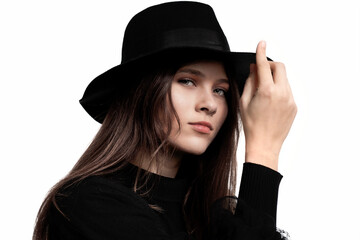 Young woman with attitude wearing a black hat