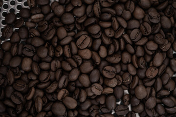 top view of fresh roasted coffee beans background