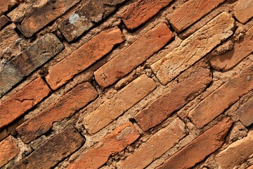 Diagonal view of an old brick wall 