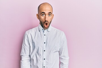 Young hispanic man wearing casual clothes afraid and shocked with surprise expression, fear and excited face.