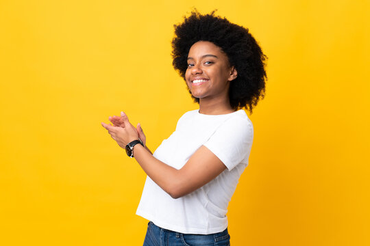 Young African American Woman Isolated On Yellow Background Applauding