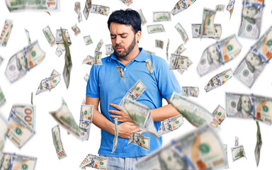 Young hispanic man wearing casual clothes with hand on stomach because indigestion, painful illness...