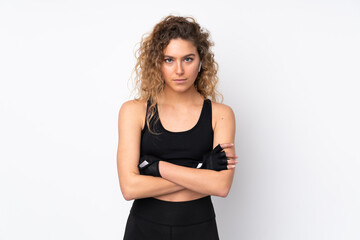 Young sport woman isolated on white background with arms crossed