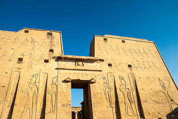 The Temple of Edfu is an ancient Egyptian temple located on the west bank of the Nile. It is the second largest temple in Egypt after Karnak  It is dedicated to the falcon god Horus
