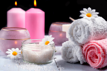 Obraz na płótnie Canvas Bath salts and towels with candles. Spa concept.