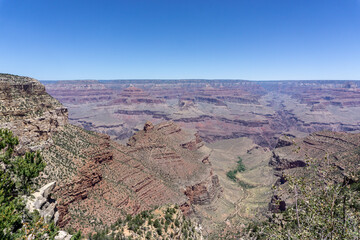 Clear skies and The Grand Canyon. that is a huge valley cut by the Colorado River.