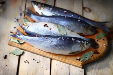 Selective focus. Spicy salted herring. Whole salted herring. Norwegian herring. Saltwater fish omega 3.