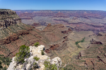 Clear skies and The Grand Canyon. that is a huge valley cut by the Colorado River.