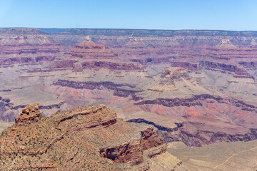 Clear skies and The Grand Canyon. that is a huge valley cut by the Colorado River.