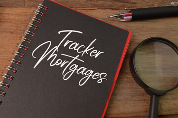 Top view of notebook written with TRACKER MORTGAGES.