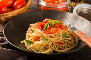 Spaghetti with tomato sauce and basil.