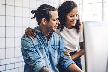 Successful of two casual business meeting and discussing strategy with new startup project.Creative business people planning and brainstorm with desktop computer in modern workloft.Teamwork concept