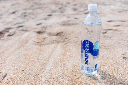 Smartwater plastic water bottle in the sand on March 26, 2021 in St. Augustine, Florida