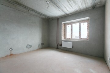 interior of the apartment without decoration in gray colors. rough finish