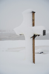 wooden cross in the snow