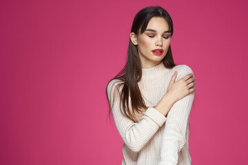 Woman with long hair and red lips white blouse pink background attractive look