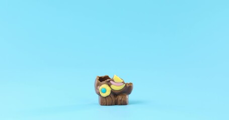 Stop motion of a chocolate Easter bunny rabbit being eaten away.