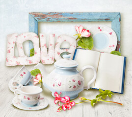 Morning tea ceremony. Collage. Tea pot and a cups. Tender beautiful blue decor