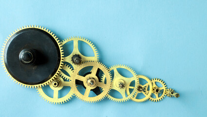 Assorted gear wheels on blue background