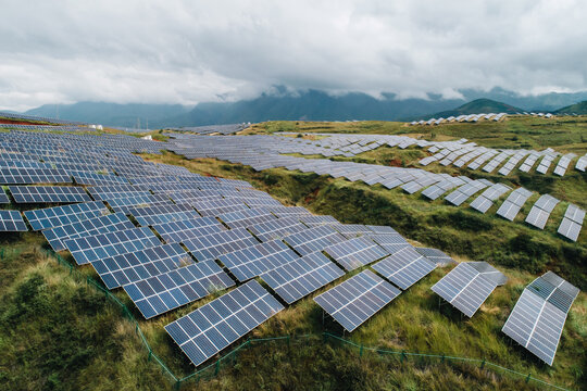 Aerial Photography of a Photovoltaic Power Plant on Lush Hillside