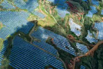 Aerial Photography of a Photovoltaic Power Plant on Lush Hillside