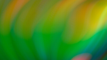 Obraz premium Abstract blurry green background with rainbow highlights