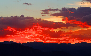 spectacular sunset over long's peak and the front range of the colorado rocky mountains as seen form broomfield, colorado