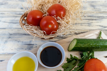 Tomatoes and cucumbers on the table, olive oil and balsamic vinegar, garlic, vegetables, vegetarianism, healthy eating