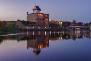 Fototapeta premium View of the Herman Castle in the lilac October twilight. Narva, Estonia