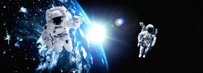 Fototapeta na wymiar Astronaut spaceman do spacewalk while working for space station in outer space . Astronaut wear full spacesuit for space operation . Elements of this image furnished by NASA space astronaut photos.