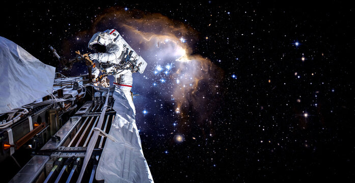 Astronaut spaceman do spacewalk while working for space station in outer space . Astronaut wear full spacesuit for space operation . Elements of this image furnished by NASA space astronaut photos.