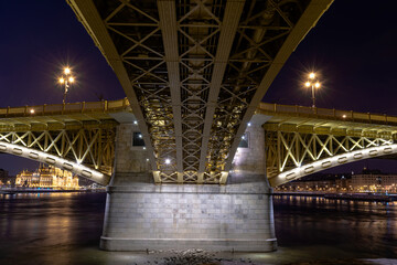 Night Budapest, Margit Bridge over the Danube River, reflection of night lights on the water