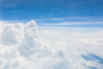Naklejka premium over the clouds,Blue sky with tiny clouds background Beautiful natural view from airplane window above. Background or Wallpaper.blue sky and cloud sky nature.Top view of aircraft
