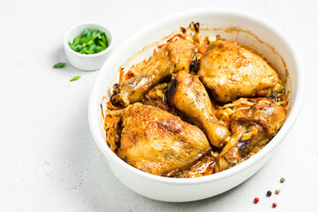Baked apple cider chicken and vegetables in baking dish. Space for text.