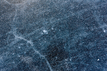Beautiful ice of Lake Baikal with abstract cracks