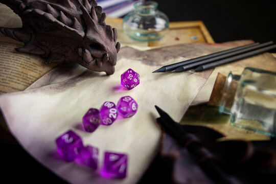 Dice, Dragon, sheet and book