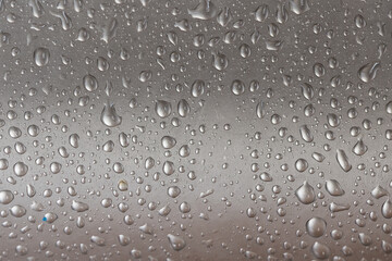 Water droplets on a metal surface. Background image.