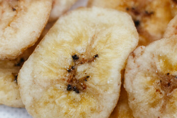 banana chips on white background close up