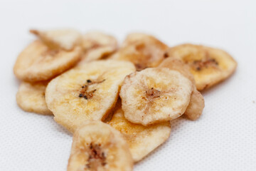 banana chips on white background close up