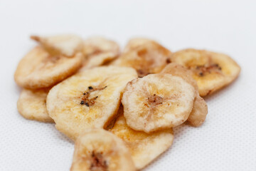 banana chips on white background close up