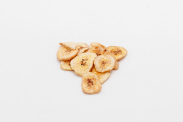 banana chips on white background close up