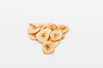 banana chips on white background close up