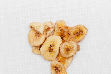 banana chips on white background close up