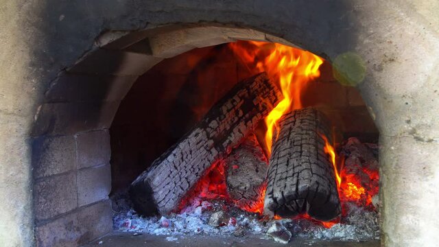Traditional wooden brick pizza oven for baking pizza with fire wood burning