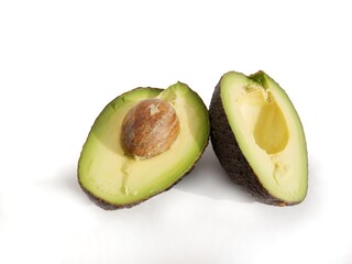 halves of cut avocado fruits close up