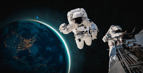 Astronaut spaceman do spacewalk while working for space station in outer space . Astronaut wear full spacesuit for space operation . Elements of this image furnished by NASA space astronaut photos.
