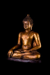 Image right side of antique gold buddha statue on black background.