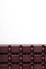 Broken dark chocolate broken stack isolated on white background